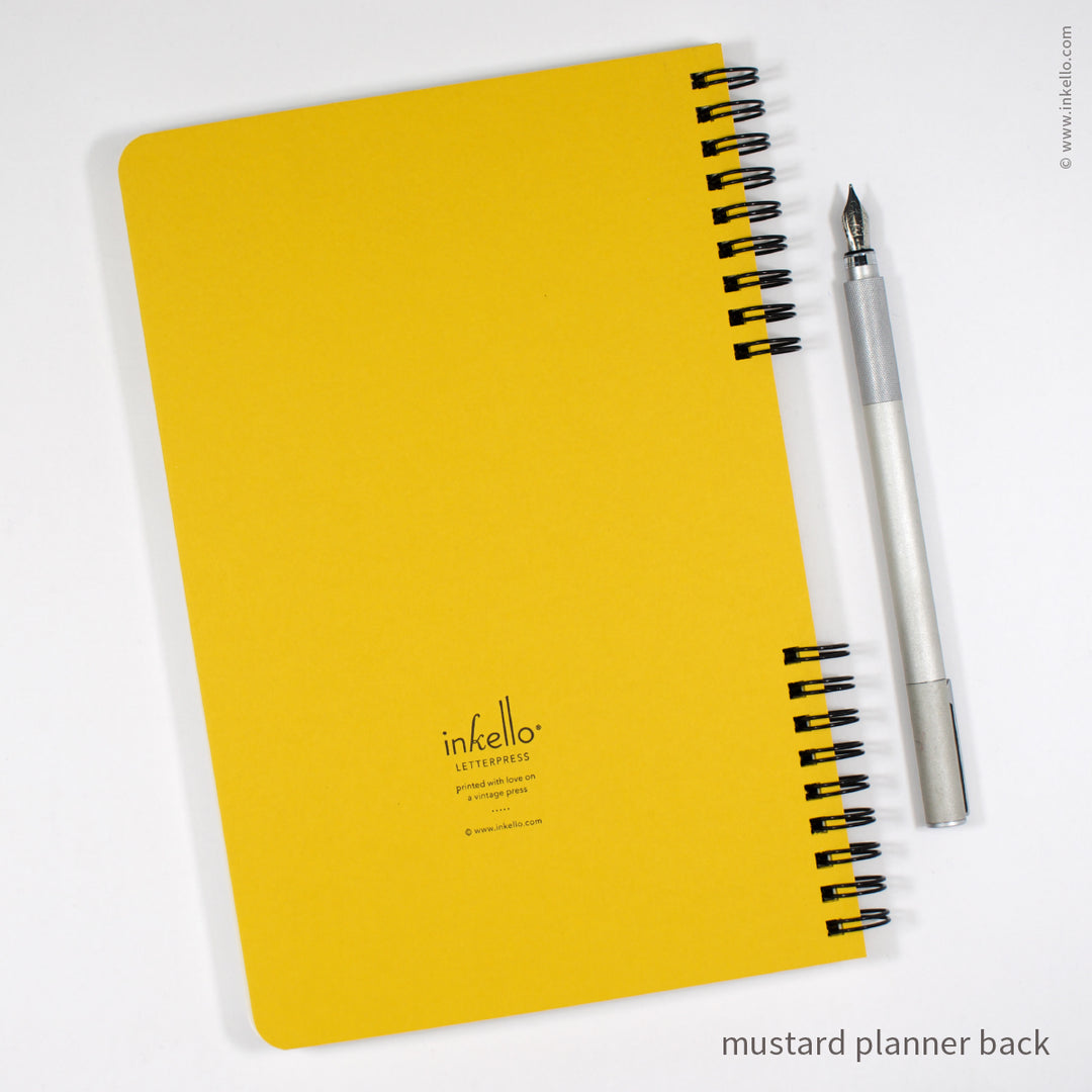 Weekly Planner with Mustard Cover and Black Script Design (