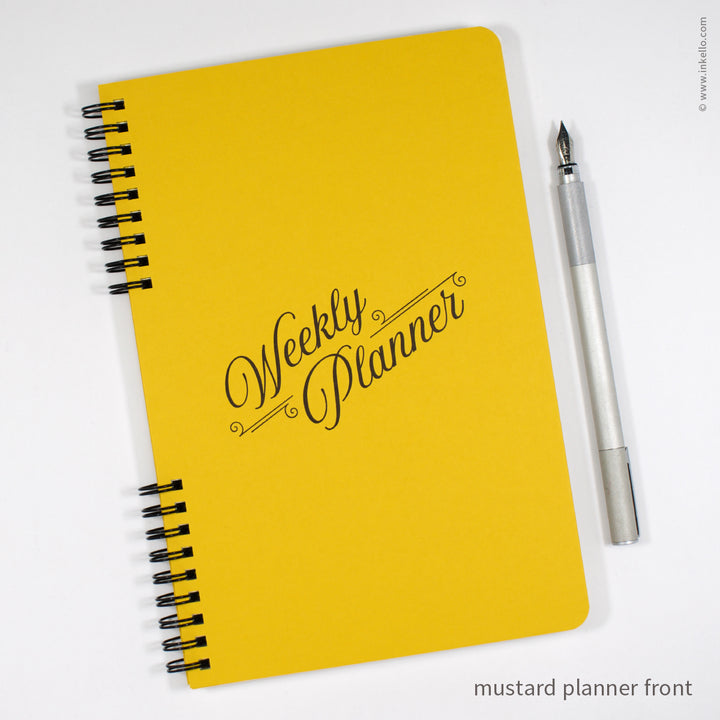 Weekly Planner with Mustard Cover and Black Script Design (