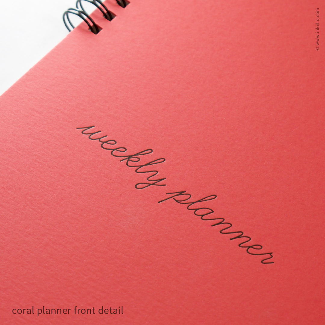Weekly Planner with Coral Cover and School Cursive in Black Ink (